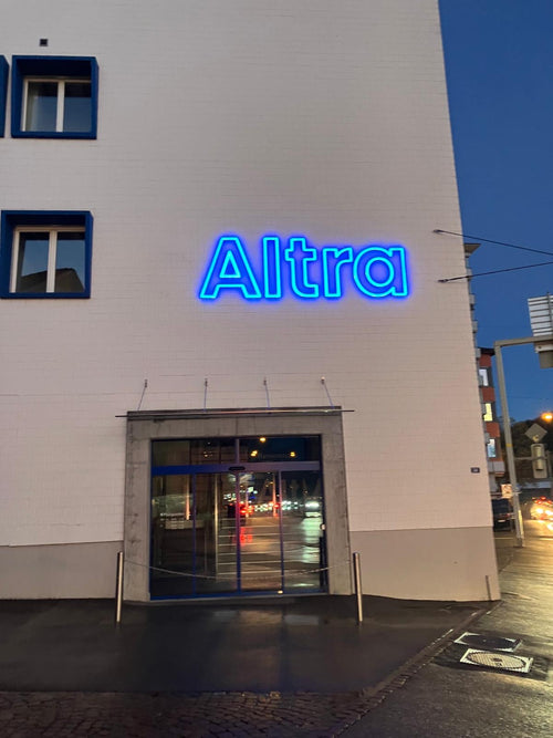 Blue LED acrylic neon sign with on a building